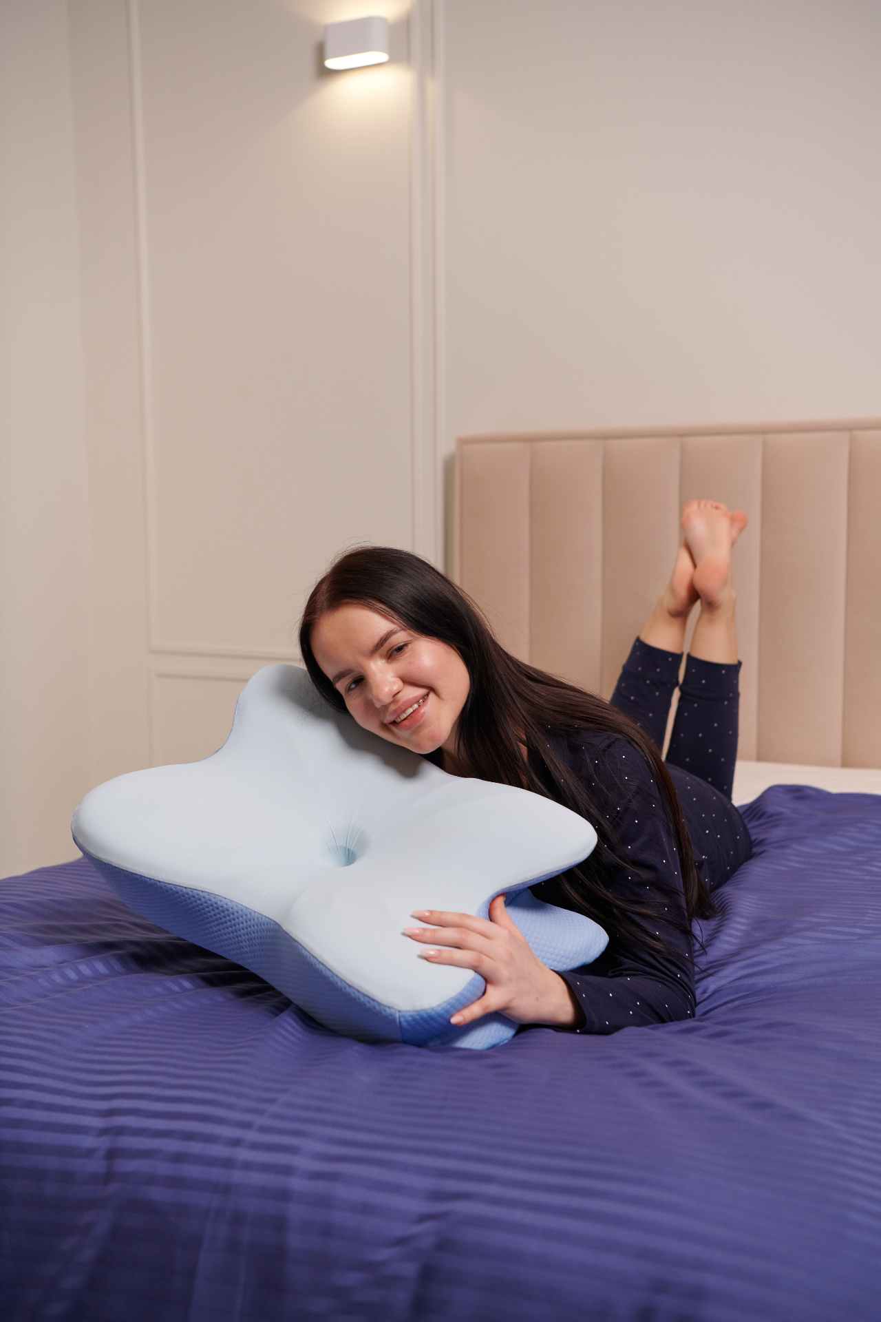 Person resting on the contoured memory foam pillow